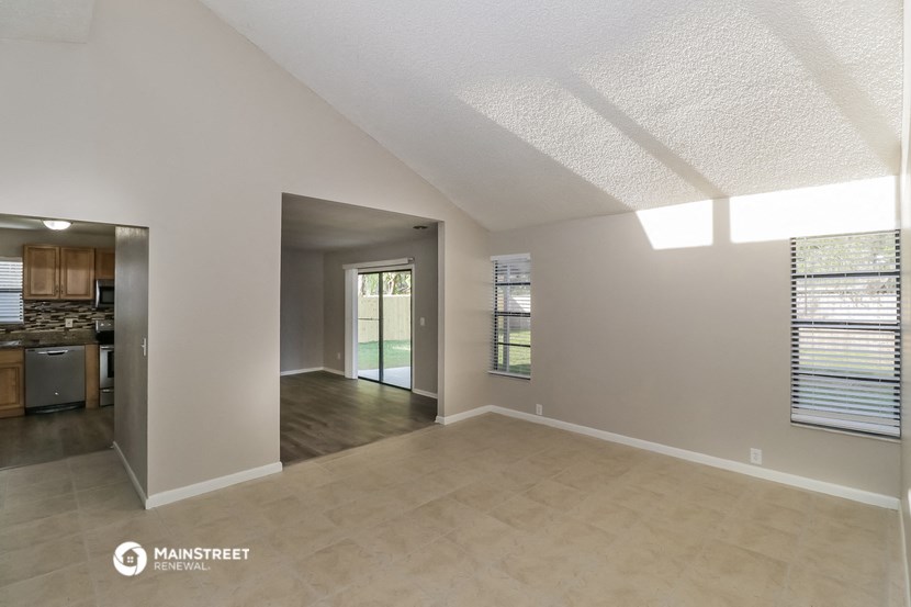 the spacious living room and kitchen of this manufactured home