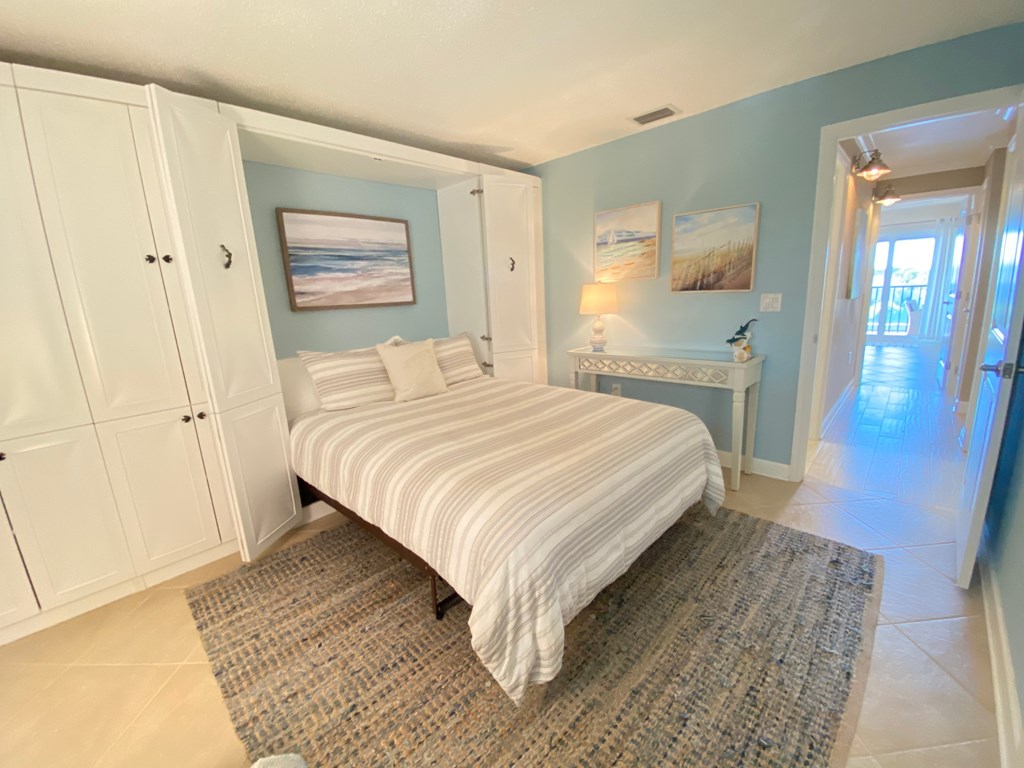 a bedroom with a bed and a closet