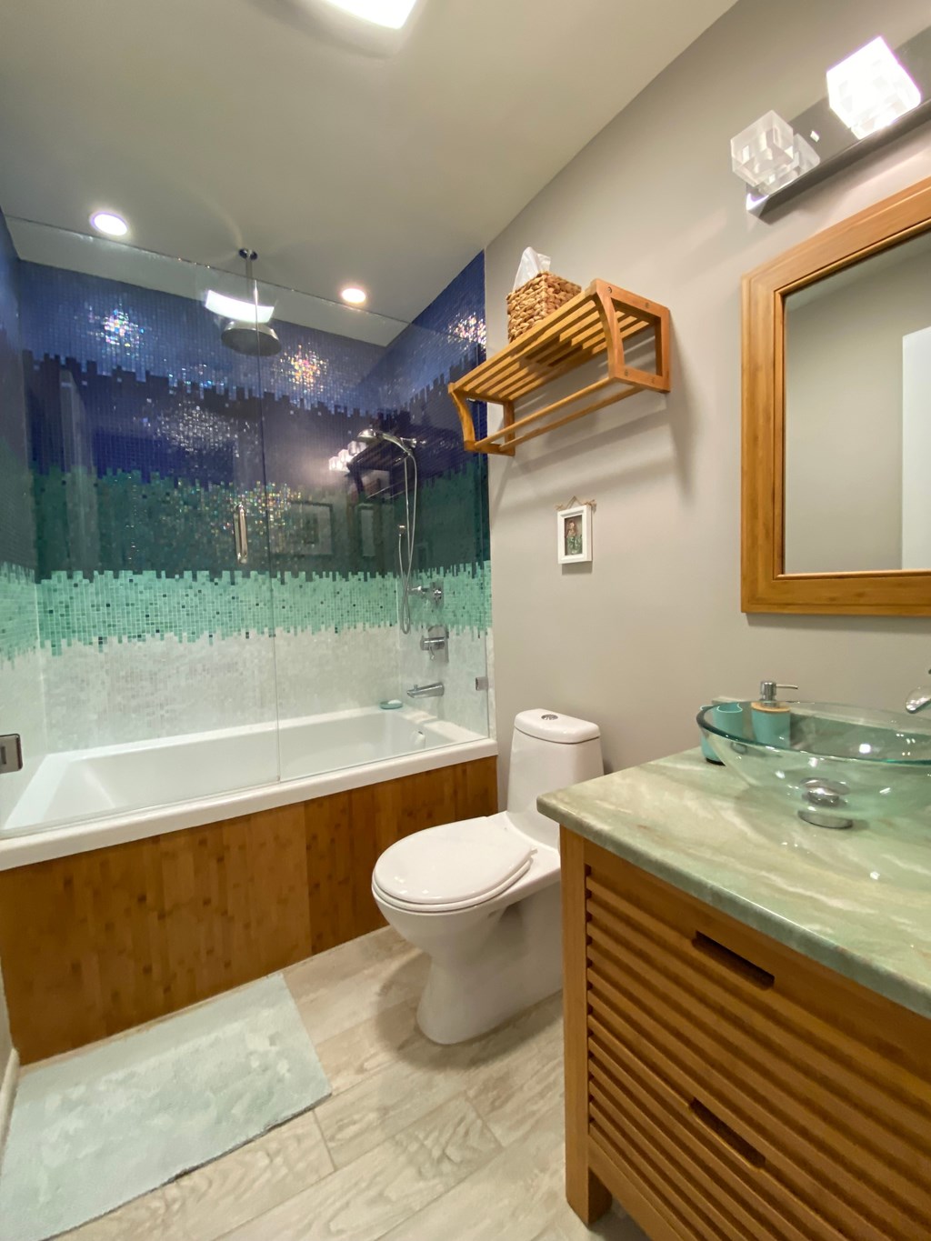 a bathroom with a shower toilet and a sink