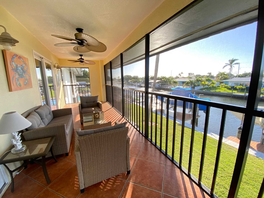 the living room has a view of the water from the balcony