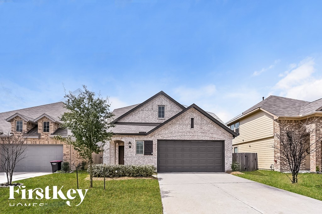 A house with a garage is for sale by FirstKey Homes.