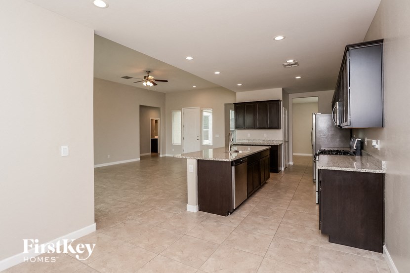 a kitchen and living room with an open floor plan