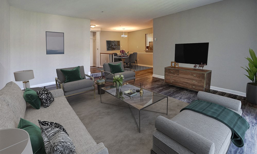 a living room with a couch and a glass table