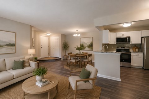 A well-lit, modern living room with a kitchen area in the background.