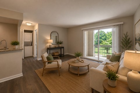 A well-lit living room with a sofa, chair, and coffee table.
