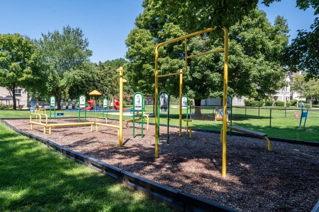 a playground in a park on a sunny day