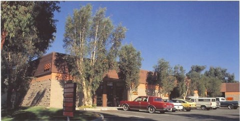a building with cars parked in front of it