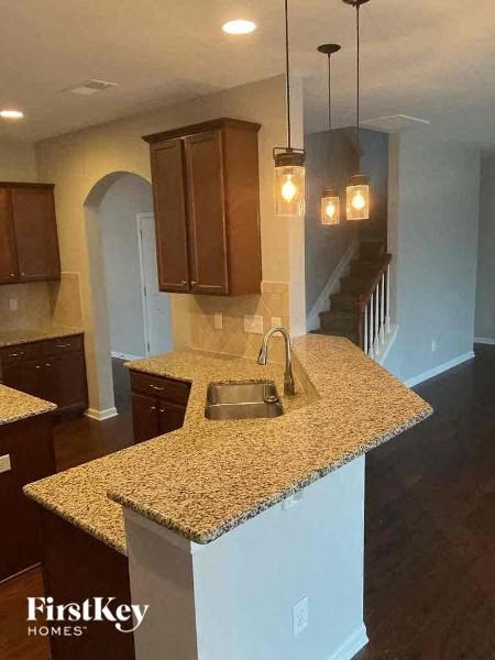a kitchen with a counter top and a sink