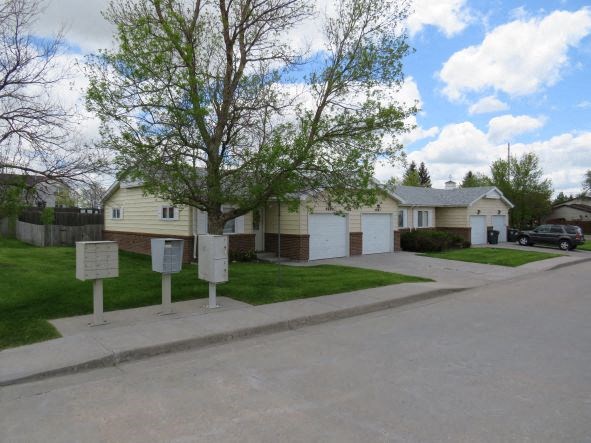 a row of houses on the side of a street