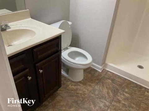 a bathroom with a toilet and a sink