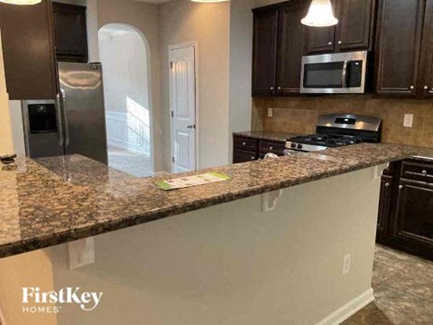 a kitchen with a granite counter top