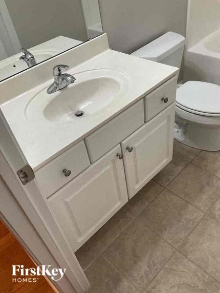 a bathroom with a sink and a toilet