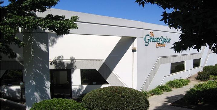a white building with a sign on the side of it