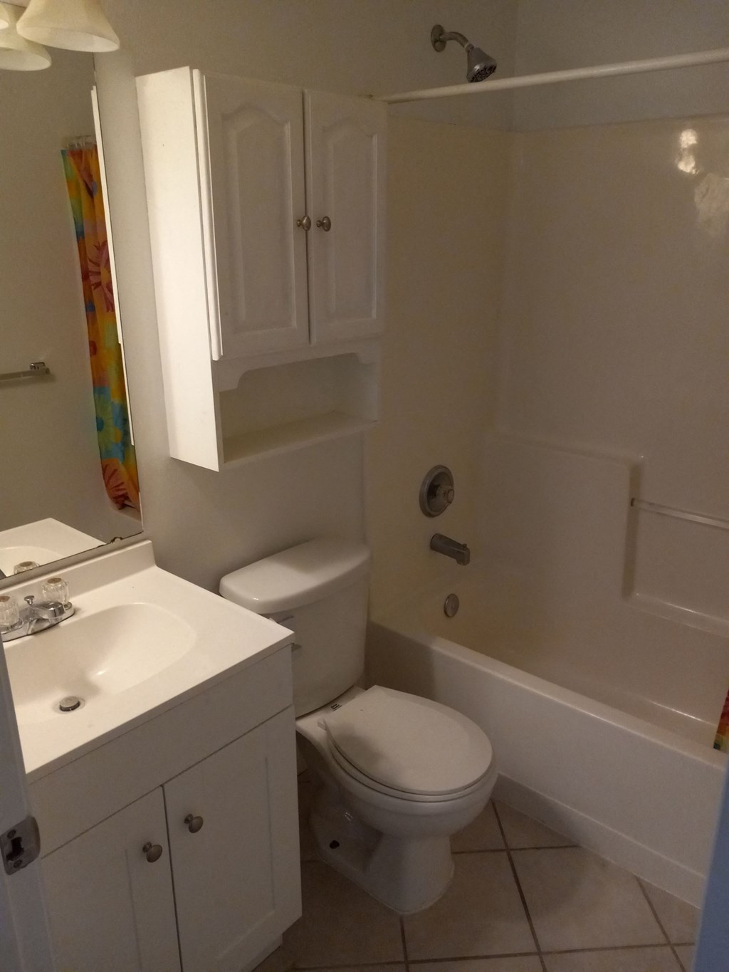 a bathroom with a toilet and a tub and a sink