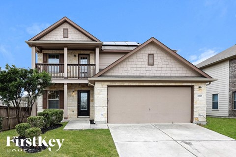 A two-story house with a garage is for sale by FirstKey Homes.