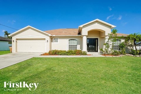 a house with a lawn in front of it