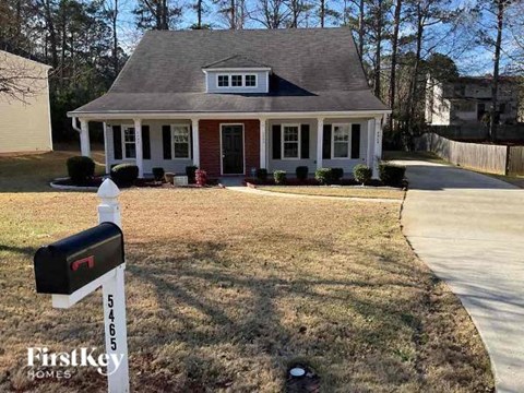 a mailbox sitting in front of a house