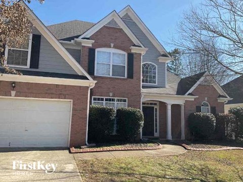 a brick house with a white garage door