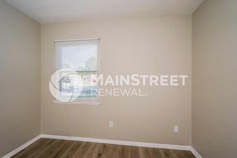 a living room with a window and a window sill