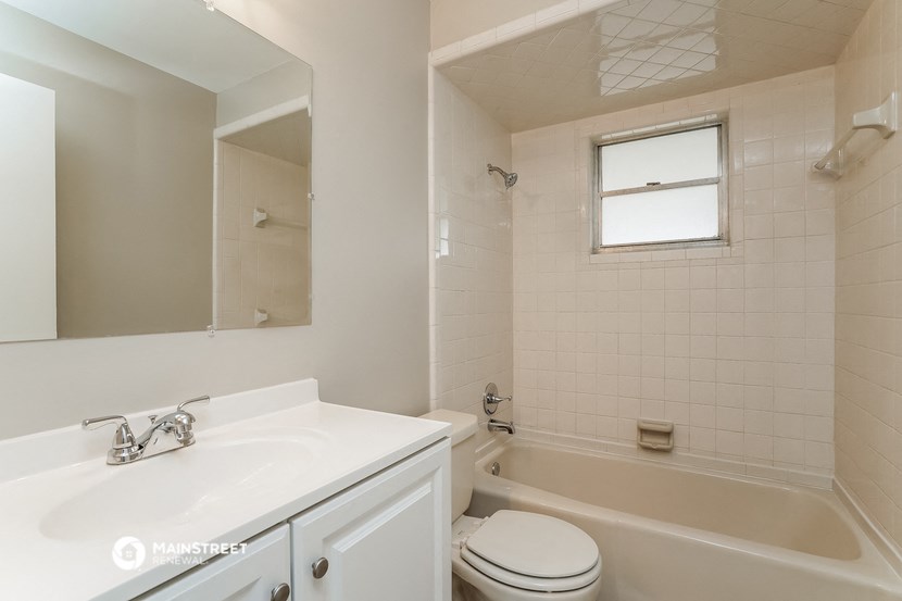 a bathroom with a sink toilet and a bath tub