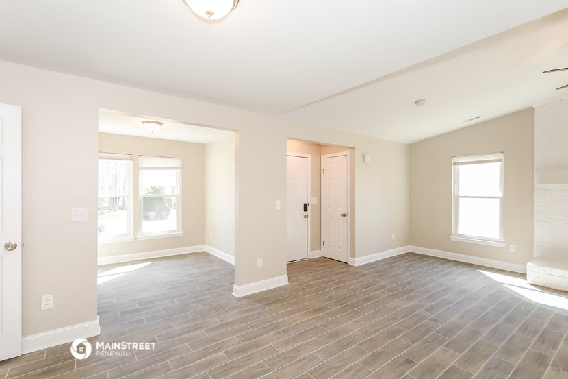 the living room and dining room of a new home