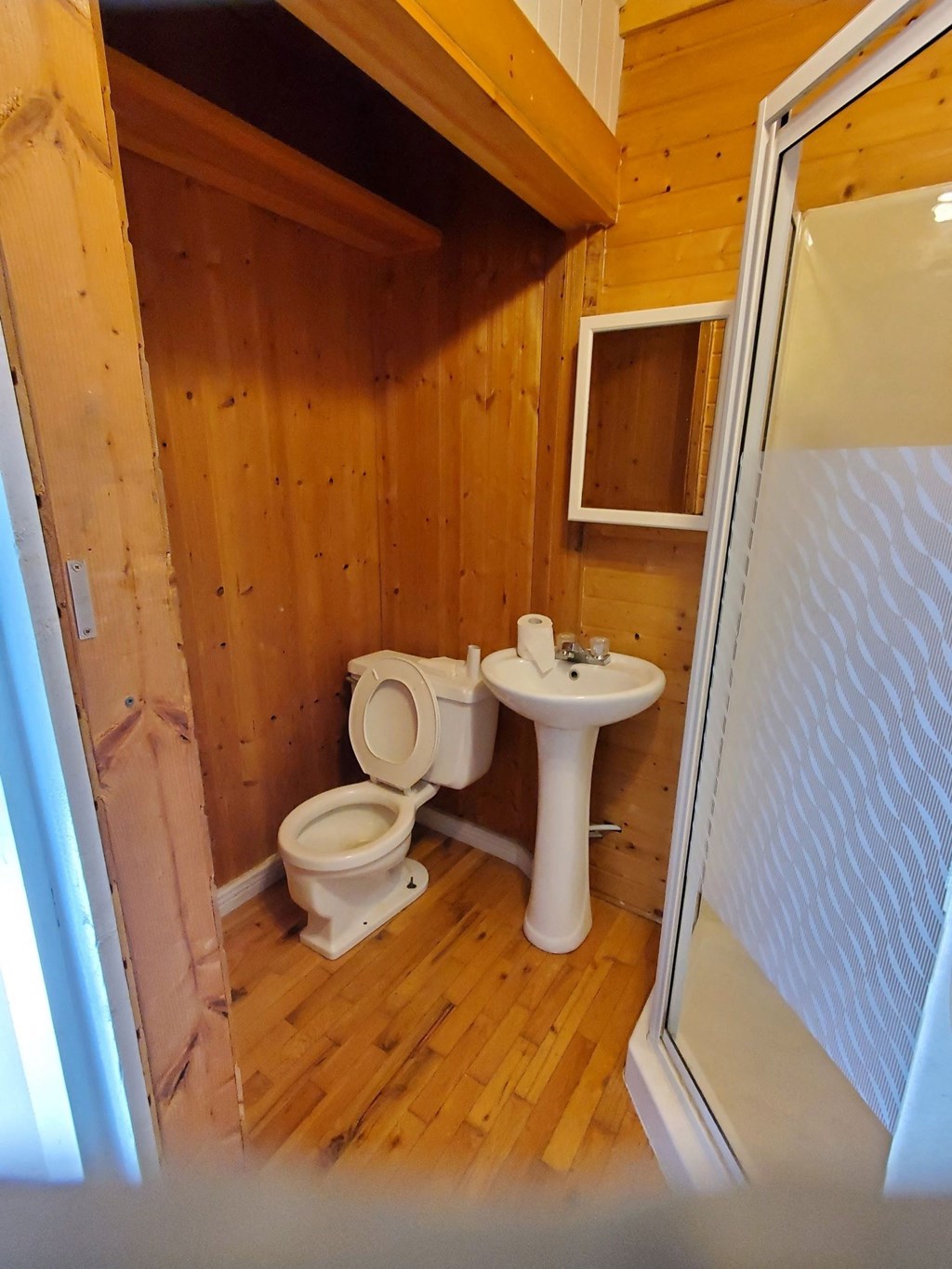 a small bathroom with a toilet sink and shower