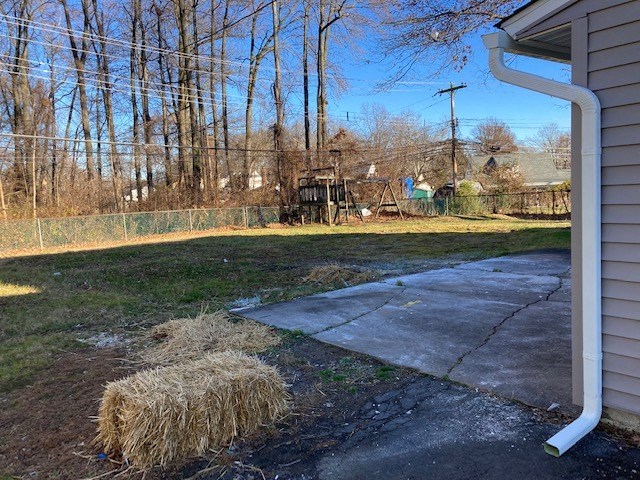 Hay bale on a driveway.