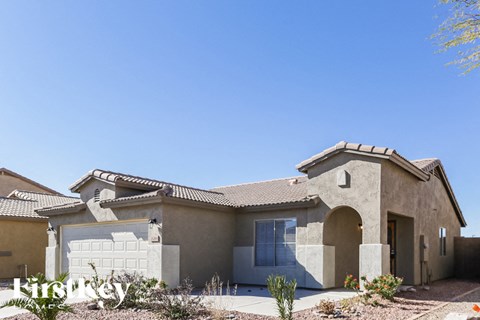 A house with a clear blue sky in the background.