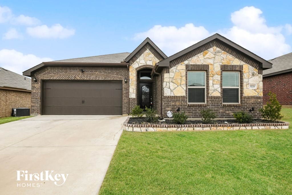 a house with a driveway and a garage door