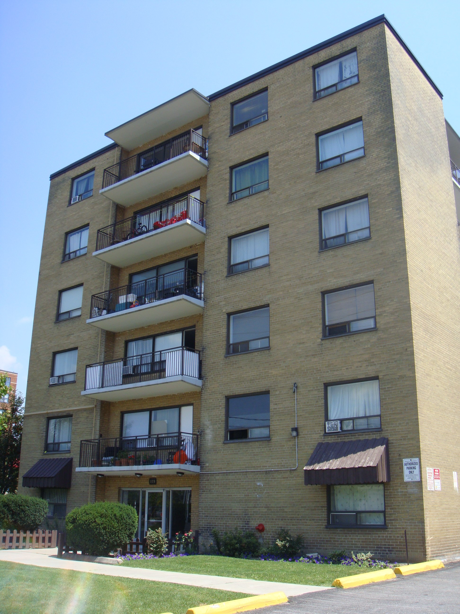 a tall apartment building with balconies on the side of it