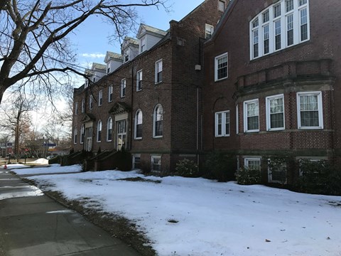a large brick building in the snow