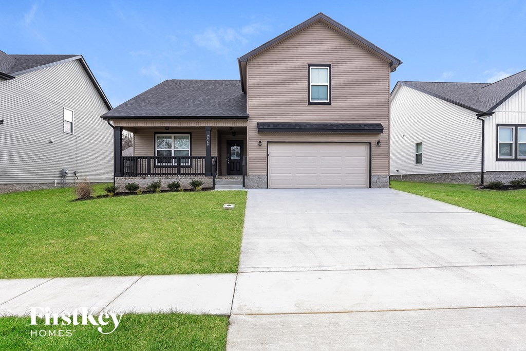 a large house with a driveway in front of it
