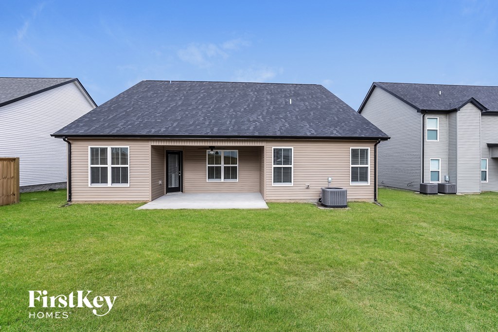 a small house with a yard in front of it