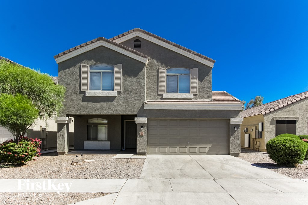 a large house with a driveway in front of it