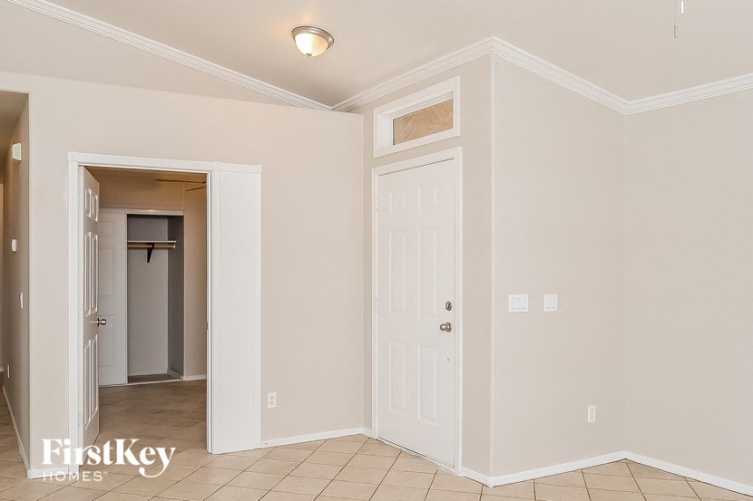 A room with a door and a window.