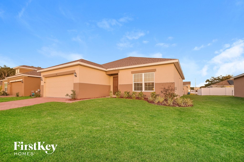a house with a lawn in front of it