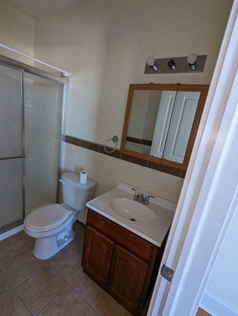 a bathroom with a sink toilet and a shower