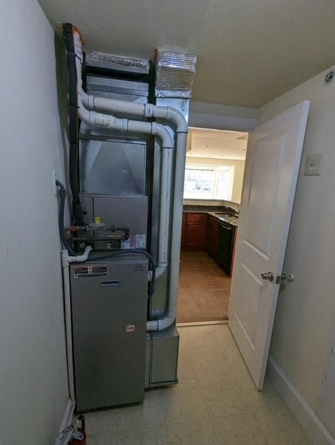 a room with a heater and a refrigerator in it