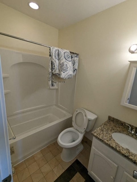 a bathroom with a toilet and a tub and a sink