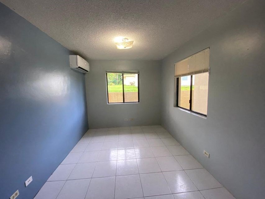 a empty room with a tile floor and a window