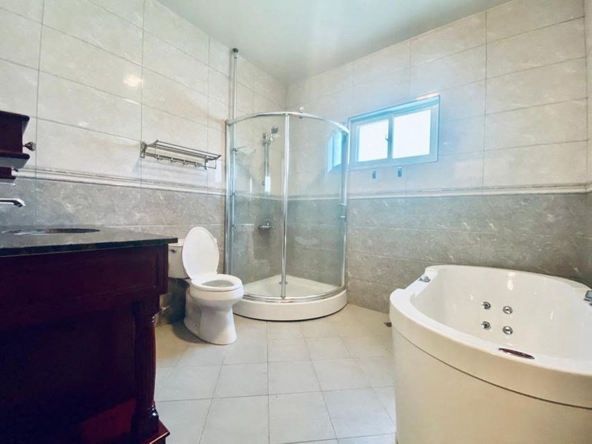 a bathroom with a shower toilet and a sink