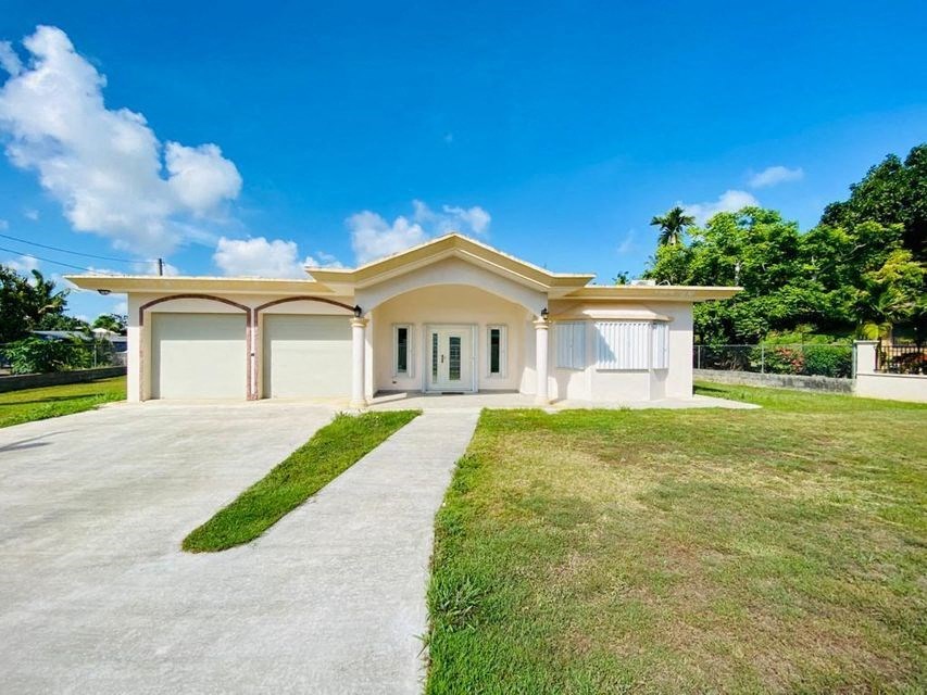 a house with a driveway and a garage door
