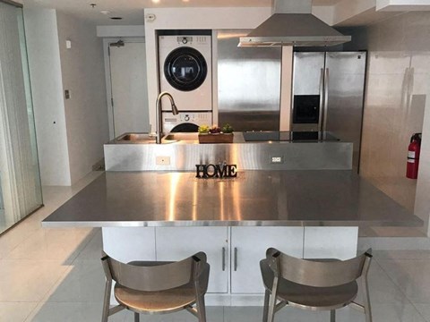 a kitchen with a counter top and a washing machine