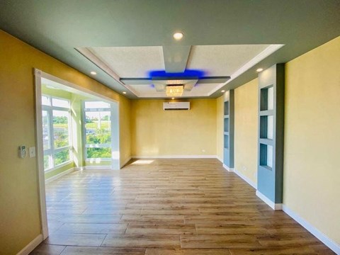 a empty room with yellow walls and a blue ceiling