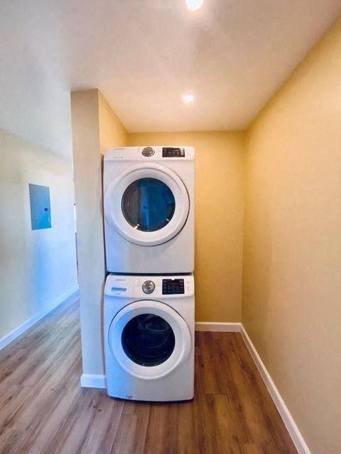 a washing machine and a dryer in a laundry room