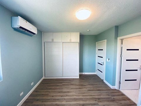 a room with blue walls and a white closet