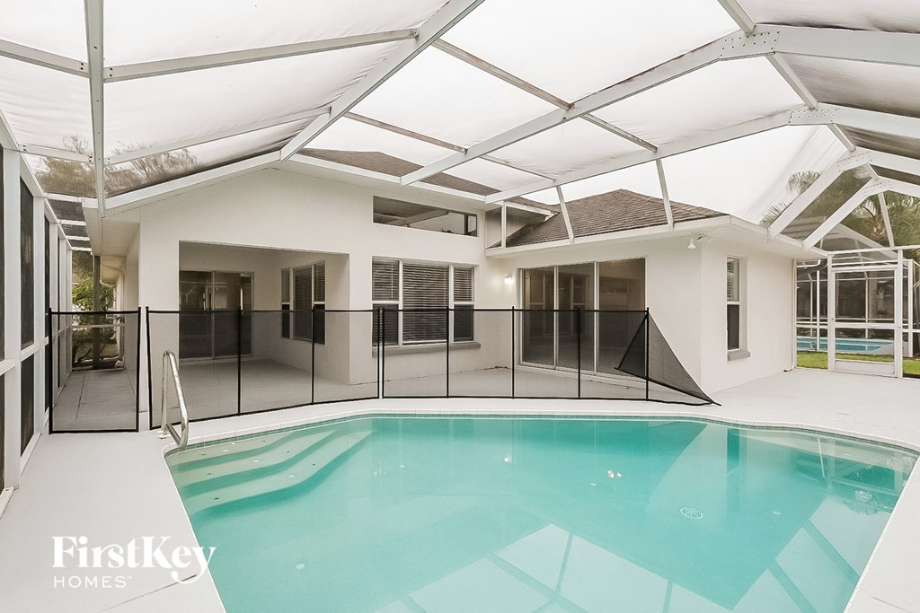a swimming pool in the middle of a house with a pool