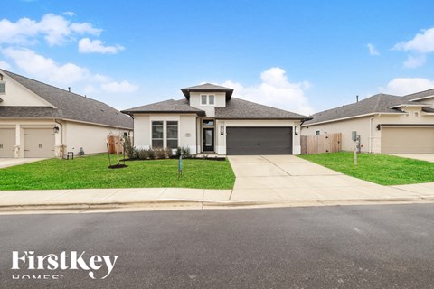 A row of houses with the words "FirstKey Homes" on the bottom left.