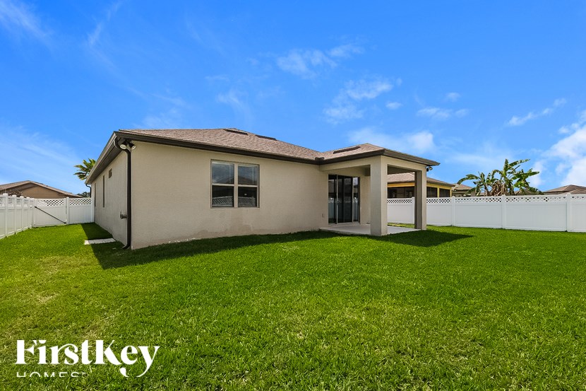 A house with a lawn in front of it is for sale with FirstKey Homes.