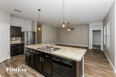 a kitchen with a sink and a counter top
